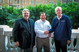 Kurt Burroughs shaking hands with Jeff Andrioff, VP of US Marketing for Mettler Toledo as Doug Korb, Western Regional Sales Manager looks on. February, 2014